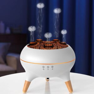 Veilleuse garçon méduse avec brume aromatique de forme ronde et de couleur blanche maintenue par des pieds en bois rappelant le style naturel scandinave sur une table de chevet.