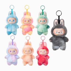 Plusieurs peluches porte-clef Labubu dans des coloris pop sur fond blanc