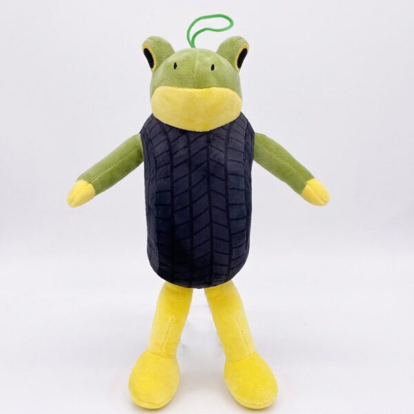 Une peluche Italian Brainrot L'Alien Zaza représentant un extraterrestre vert et jaune, avec de longues jambes, des bras écartés et un corps noir, sur fond blanc.
